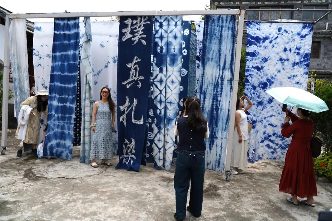 Indigo tie-dyed cloths hanging in a Bai courtyard near Dali