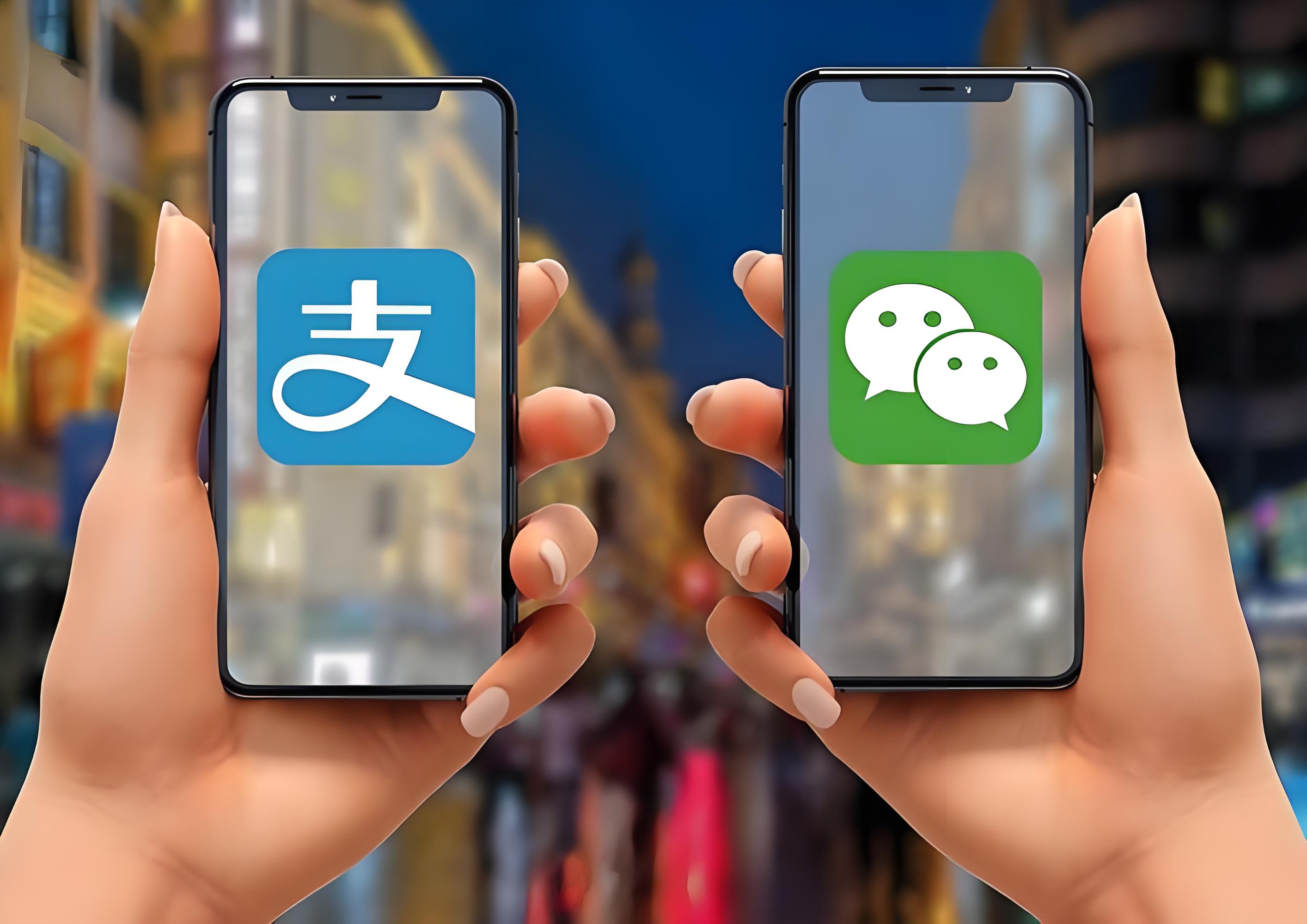 Two hands holding phones displaying the Alipay and WeChat logos