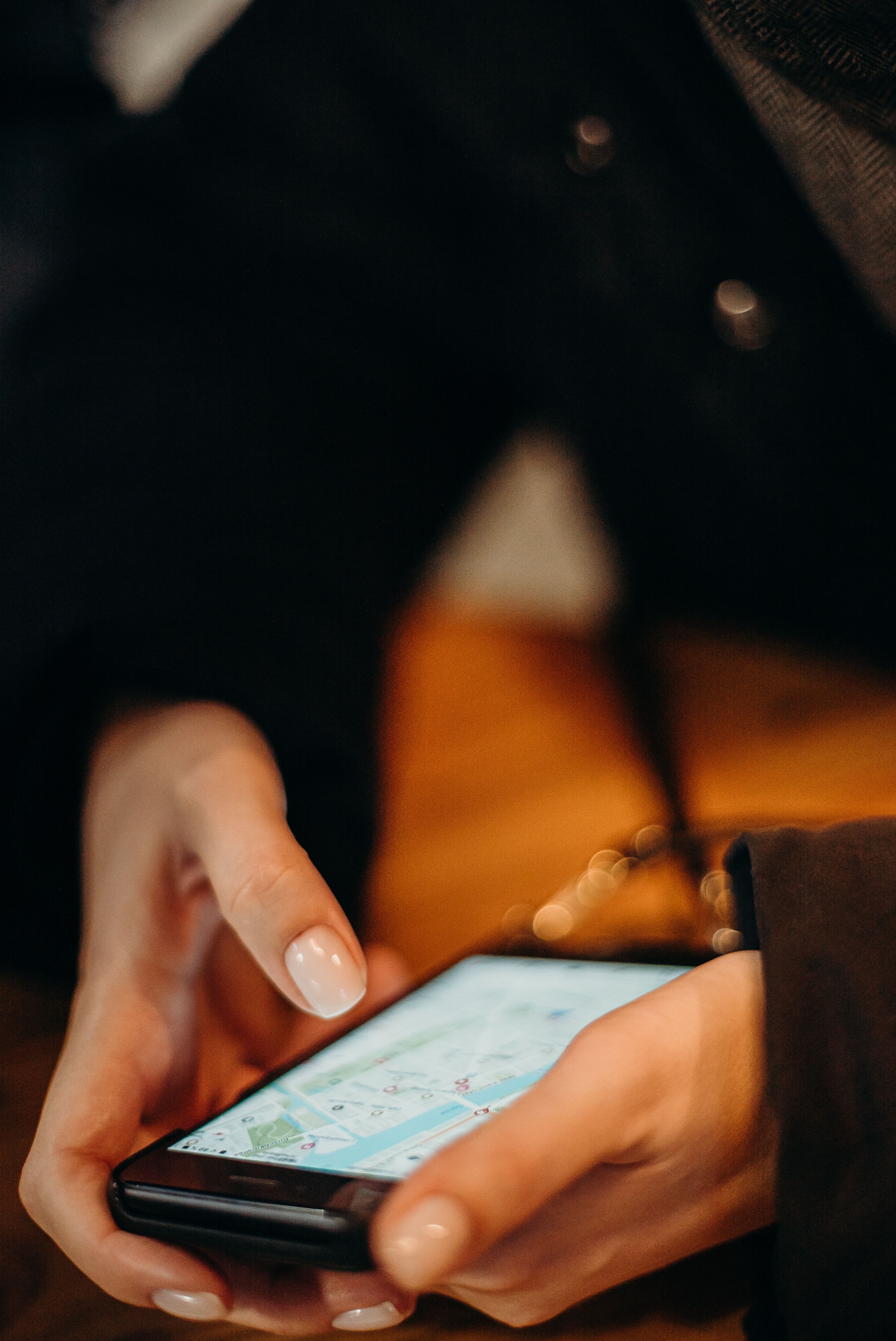 A traveller using a map on a smartphone